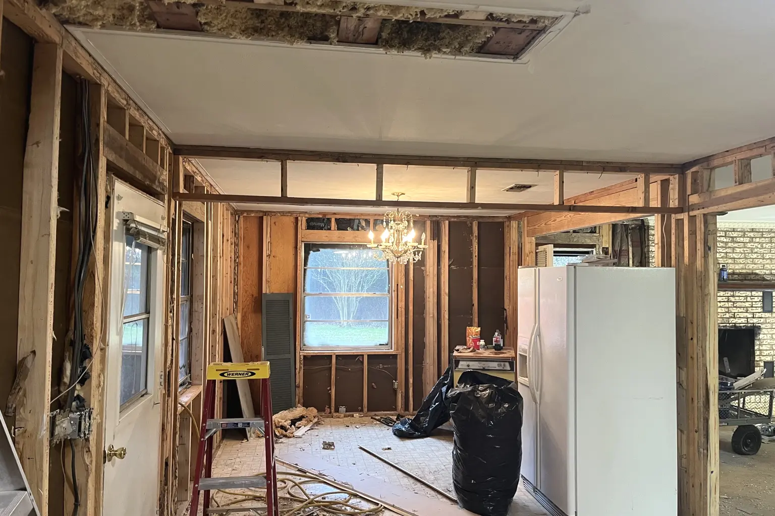 Interior remodeling demolition opened to the wall and ceiling framing
